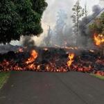PAHOA, HI - MAY 6: In this handout photo provided by the U.S. Geological Survey, a lava flow moves on Makamae Street after the eruption of Hawaii's Kilauea volcano on May 6, 2018 in the Leilani Estates subdivision near Pahoa, Hawaii. The governor of Hawaii has declared a local state of emergency near the Mount Kilauea volcano after it erupted following a 5.0-magnitude earthquake, forcing the evacuation of nearly 1,700 residents. (Photo by U.S. Geological Survey via Getty Images)