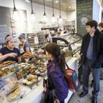 Boston, MA - 5/9/2017 - Customers wait in line for lunch orders bought in store at Flour Bakery in Cambridge, MA, May 9, 2017. (Keith Bedford/Globe Staff)