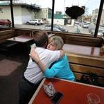 Allston, MA., 05/11/18, The Bus Stop Pub owner, Joyce Hynds, cq, gets a good bye hug from long time customer Mark Lydon. The Bus Stop Pub, an Allston neighborhood bar, is closing after 38 years, squeezed out by Harvard University's massive expansion into North Allston and the simultaneous gentrification of the blue-collar neighborhood. Suzanne Kreiter/Globe staff