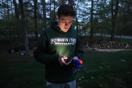 A water-gun-armed Cameron Conley, a senior at Medway High School, was in the backyard of his ?Senior Assassin? target, texting his friends Rob DiGregorio and Joey Bevilacqua, who dropped him off and were waiting around the corner in Bevilacqua's car.
