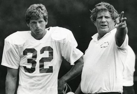Andy Johnson (left, with assistant coach Jim Ringo) at training camp in 1981. 
