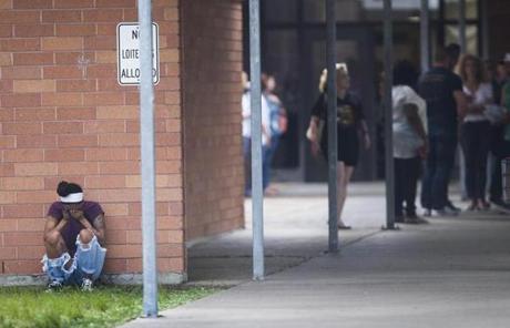 TEXAS SHOOTING SLIDER People gather by the Barnett Intermediate School where parents are gathering to pick up their children following a shooting at Santa Fe High School Friday, May 18, 2018, in Santa Fe, Texas. (Marie D. De Jesus/Houston Chronicle via AP)

