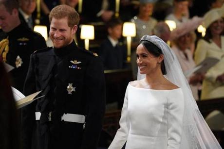 Prince Harry and Meghan Markle stand at the altar during their wedding in St. George?s Chapel.
