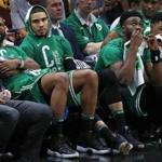 Cleveland, OH: 5-19-18: The expressions on the bench in the fourth quarter of the Celtics (left to right) Marcus Morris, Jayson Tatum, Jaylen Brown and Marcus Smart tell the story of Boston's 116-86 loss. The Boston Celtics visited the Cleveland Cavaliers for Game Three of their NBA Eastern Conference Finals playoff series at the Quicken Loans Arena. (Jim Davis/Globe Staff)