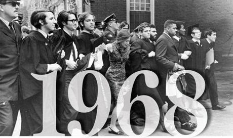 At Harvard?s 1968 commencement, police removed demonstrators from Harvard Yard. The group was protesting the choice of the Shah of Iran as commencement speaker. Third from right is Donald King. 
