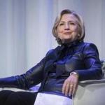 FILE - In this Wednesday, Dec. 13, 2017 file photo, Hillary Clinton sits on stage during a book tour event in Vancouver, British Columbia, Canada. On May 11, 2018, The Associated Press has found that stories circulating on the internet that Clinton is New York?s new attorney general are untrue. (Darryl Dyck/The Canadian Press via AP)