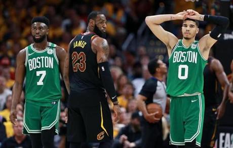 LeBron James (center) and the Cavaliers left Jaylen Brown (left) and Jayson Tatum (right) wondering what hit them.
