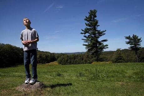 Nelson, NH- September 02, 2017: Connor Biscan stood atop a small rock and searched the sky for the balloons he had lost at a family gathering in Nelson, N.H., on Labor Day weekend last September. Connor had flown the balloons in an open field behind his great-grandfather's house. When the kite string broke and the balloons snagged on a tree, Connor became anxious. His mother, Roberta Biscan, praised him for remaining calm. As a baby, balloon was his first word. (Craig F. Walker/Globe Staff) section: metro reporter: kowalczyk
