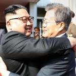 North Korea?s leader Kim Jong Un (left) and his South Korean counterpart, Moon Jae-in, hugged in this image handed out by Seoul government officials Saturday after the leaders? second summit. 