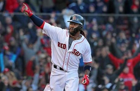 Boston, MA: 4/5/2018: The Red Sox Hanley Ramirez won the game for Boston with a bottom of the twelfth inning bases loaded walk off single, as the home team won3-2. He is pictured raising his arm in celebration after his hit. The Boston Red Sox hosted the Tampa Bay Rays in their 2018 MLB home Opening Day baseball game at Fenway Park. (Jim Davis/Globe Staff)
