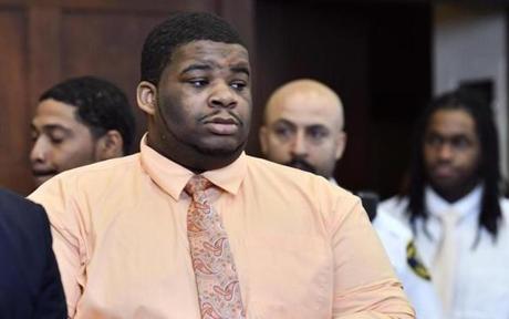 Jaden Waiters (center) entered a Boston courtroom for opening statements in his trial.
