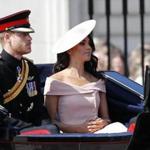 Britain's Prince Harry, left, and Meghan, Duchess of Sussex ride in a carriage to attend the annual Trooping the Colour Ceremony in London, Saturday, June 9, 2018.(AP Photo/Frank Augstein)