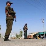 Afghan troops stood guard Thursday at a check point in Kandahar.