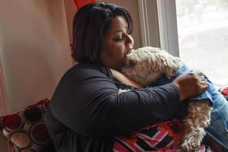 Amarilys Martinez held her dog Nikko in Nashua, N.H., on Wednesday after they were reunited.
