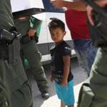 MISSION, TX - JUNE 12: U.S. Border Patrol agents take into custody a father and son from Honduras near the U.S.-Mexico border on June 12, 2018 near Mission, Texas. The asylum seekers were then sent to a U.S. Customs and Border Protection (CBP) processing center for possible separation. U.S. border authorities are executing the Trump administration's zero tolerance policy towards undocumented immigrants. U.S. Attorney General Jeff Sessions also said that domestic and gang violence in immigrants' country of origin would no longer qualify them for political-asylum status. (Photo by John Moore/Getty Images)