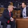 FILE - In this Sept. 15, 2016 image originally released by NBC, Republican presidential candidate Donald Trump appears with host Jimmy Fallon during a taping of 
