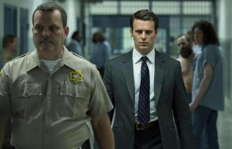 This image released by Netflix shows Jonathan Groff in a scene from the 10-episode series, 