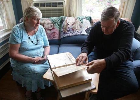 Eleanor Sullivan Donato and Tom Sullivan flipped through a photo album and scrap book while they talked about their brother, Paul J. Sullivan, who was killed in Vietnam 50 years ago. The family will award the 50th scholarship in his memory. 
