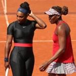 PARIS, FRANCE - JUNE 03: Venus Williams of The United States and partner Serena Williams in conversation during their ladies doubles fourth round match againstAndreja Klepac of Slovenia and Maria Jose Martinez Sanchez of Spain during day eight of the 2018 French Open at Roland Garros on June 3, 2018 in Paris, France. (Photo by Matthew Stockman/Getty Images)