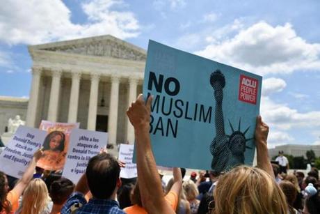 People protest the Muslim travel ban outside of the US Supreme Court in Washington, DC on June 26, 2018. The US Supreme Court on Tuesday upheld President Donald Trump's controversial ban on travelers from five mostly Muslim countries -- a major victory for the Republican leader after a tortuous legal battle. In a majority opinion written by Chief Justice John Roberts, the court ruled 5-4 that the most recent version of the ban, which the administration claims is justified by national security concerns, was valid.
