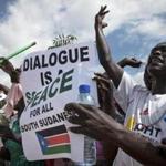 South Sudanese people cheered as they awaited the arrival back in their country of South Sudan President Salva Kiir, at the airport in Juba. 