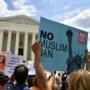 People protested the Muslim travel ban Tuesday outside of the Supreme Court.
