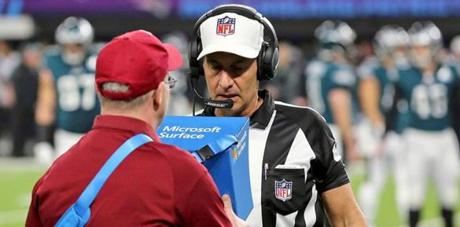 FILE - In this Feb. 4, 2018, file photo, referee Gene Steratore reviews a touchdown reception by Philadelphia Eagles' Corey Clement touchdown during NFL football's Super Bowl 52 against the New England Patriots in Minneapolis. The NFL's catch rule would get less complicated if team owners approve recommendations from the powerful competition committee, when the league's annual meetings begin on Monday in Orlando, Fla. (AP Photo/Gregory Payan)
