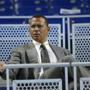 FILE - In this June 23, 2017, file photo, former baseball player Alex Rodriguez sits in the stands before the start of a baseball game in Miami. Rodriguez once again is taking over for Aaron Boone in a high-profile spot, this time moving into the ESPN booth for Sunday Night Baseball. ESPN announced Tuesday, Jan. 23, 2018, that A-Rod was joining its crew as an analyst. The former star slugger will become a rare, two-network announcer _ he will continue as a studio analyst for Fox Sports in the postseason. Rodriguez fills the ESPN spot held last season by Boone, hired last month to manage the New York Yankees. It will mark the second time Rodriguez has followed Boone. (AP Photo/Wilfredo Lee, File)