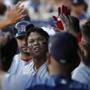 Boston Red Sox's Rafael Devers is congratulated by teammates after hitting a grand slam against the New York Yankees during the first inning of a baseball game, Saturday, June 30, 2018, in New York. (AP Photo/Julie Jacobson)