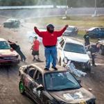 Dylan Fielding celebrates at the finish of the demolition-style Flagpole Race, held at the end of each racing day at New Hampshire?s Hudson Speedway.