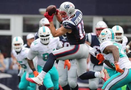 Foxborough, MA 9/18/16 Patriots Julian Edelman catches for a gain in the first quarter during a game against the Miami Dolphins at Gillette Stadium. (Matthew J. Lee/Globe Staff)
