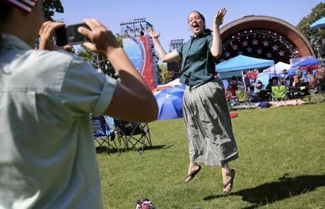 SLIDER-- Jenna Boller, left, makes a picture Melinda Goodwin while waiting for the Boston Pops Fireworks Spectacular to begin at the Hatch Shell on the Esplanade in Boston, MA on July 04, 2018. (Craig F. Walker/Globe Staff) section: metro reporter:
