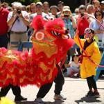 Boston-7/7/2018 An all-day celebration of Chinese and Chinese-American culture took place on the Rose Kennedy Greenway in Chinatown. Stanley Tang, 7, tries to wrangle in the lion during a lion dance performance. Photo by John Tlumacki/Globe Staff(metro)