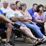MILLVILLE, 7/4/2018 - Town residents look on during a special Board of Selectmen outlining cuts to town services. Voters rejected a Prop 2 1/2 override vote forcing the town to end trash service, closed its senior center, and to turn off more than half of it's street lights. Josh Reynolds for The Boston Globe (Metro, Crimaldi) 