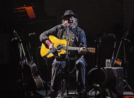 Neil Young performs solo at the Boch Center Wang Theatre.
