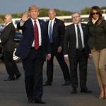 President Trump and first lady Melania Trump arrived at Glasgow Prestwick Airport on Friday and were greeted by David Mundell (second from right), secretary of state for Scotland.