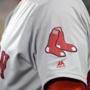 The Boston Red Sox logo is seen on first base coach Ruben Amaro Jr's jersey during a baseball game against the Baltimore Orioles in Baltimore, Saturday, April 22, 2017. (AP Photo/Patrick Semansky)