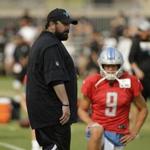 Detroit Lions head coach Matt Patricia watches players stretch as quarterback Matthew Stafford looks on during NFL football practice Tuesday, Aug. 7, 2018, in Napa, Calif. The Oakland Raiders and the Lions held a joint practice before their upcoming preseason game on Friday. (AP Photo/Eric Risberg)