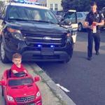19zoblotter -- This photo of a Malden police officer pulling over a 1-year-old boy in a miniature red Mercedes became a big hit on social media. (Cori Salerno)
