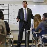 Boston Mayor Marty Walsh talks to middle schoolers during a tour of their school in June 2017. 