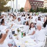 Guests wave their white napkins at Le Diner en Blanc on the Rose Fitzgerald Kennedy Greenway last year.