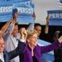 Cambridge, MA - 9/9/18 - At the end of Senator Elizabeth Warren's (cq) speech, she held up hands with Jay Gonzalez (cq) and Ayanna Pressley (cq). Democrats rally, at the Cambridge Community Center, in support of their nominees on the 2018 ballot. Photo by Pat Greenhouse/Globe Staff Topic: 10demsrally Reporter: John Hilliard