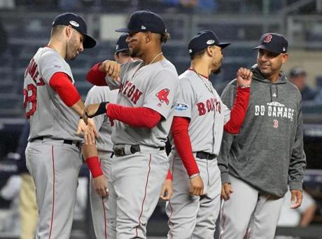 New York, NY: 10-08-18: Red Sox manager Alex Cora (far right) is pictured duing pre game introductions. The Boston Red Sox visited the New York Yankees for Game Three of their MLB ALDS baseball playoffs at Yankee Stadium. (Jim Davis/Globe Staff) 
