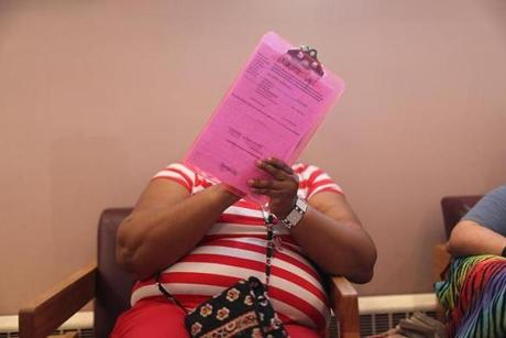 Erica Harris registered to vote for the first time ever at the Pine Street Inn?s voter registration forum on Wednesday.
