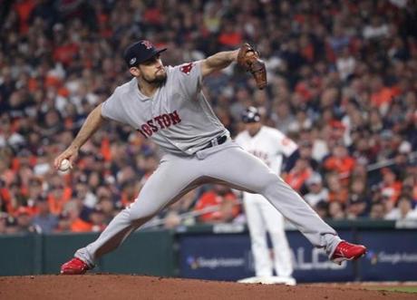 Houston TX 10/16/18: Red Sox pitcher Nathan Eovaldi pitches in the first inning. Houston Astros hosted Boston Red Sox in Game Three of ALCS at Minute Maid Park Tuesday, Oct. 16, 2018. (Barry Chin/Globe Staff)
