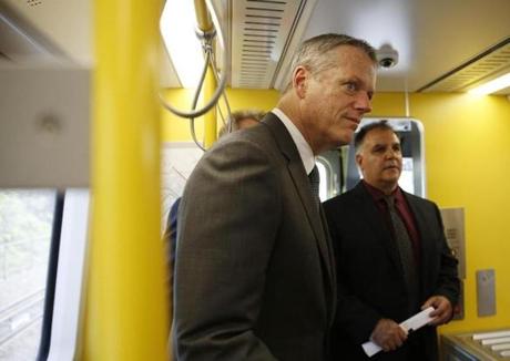 Medford, MA--5/15/2018-- (L-R) Governor Charlie Baker is given a tour of a new Orange Line car by Mark DeVitto, the MBTA's Senior Technical Project Manager for Vehicle Engineering. (Jessica Rinaldi/Globe Staff) Topic: 17orangeline Reporter:
