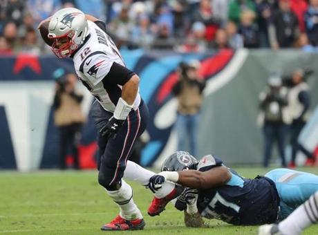 Nashville TN 11/11/18 New England Patriots Tom Brady breaks a possible sack from Tennessee Titans Darius Kilgo during fourth quarter action at Nissan Field. (photo by Matthew J. Lee/Globe staff) topic: reporter: 
