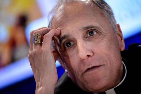 Galveston-Houston Cardinal Daniel DiNardo, president of the United States Conference of Catholic Bishops general assembly, listened during a press conference Monday  in Baltimore.
