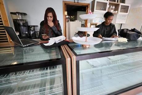 Elizabeth Bautista (right) and her business partner, Deya Garcia, shown in October in their closed shop Delish Bakery and Cafe in Lawrence. 
