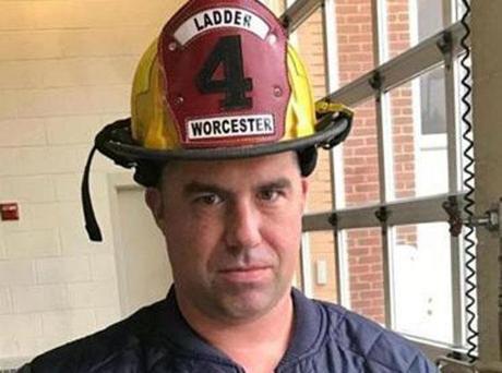 Eight residents were displaced during Sunday morning?s five-alarm fire on Lowell Street in Worcester. Firefighter Christopher Roy died while battling the blaze. (Pat Greenhouse/Globe Staff)
